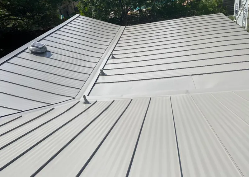 Solar attic fan installed on a metal roof for Roof Ventilation in Westphalia